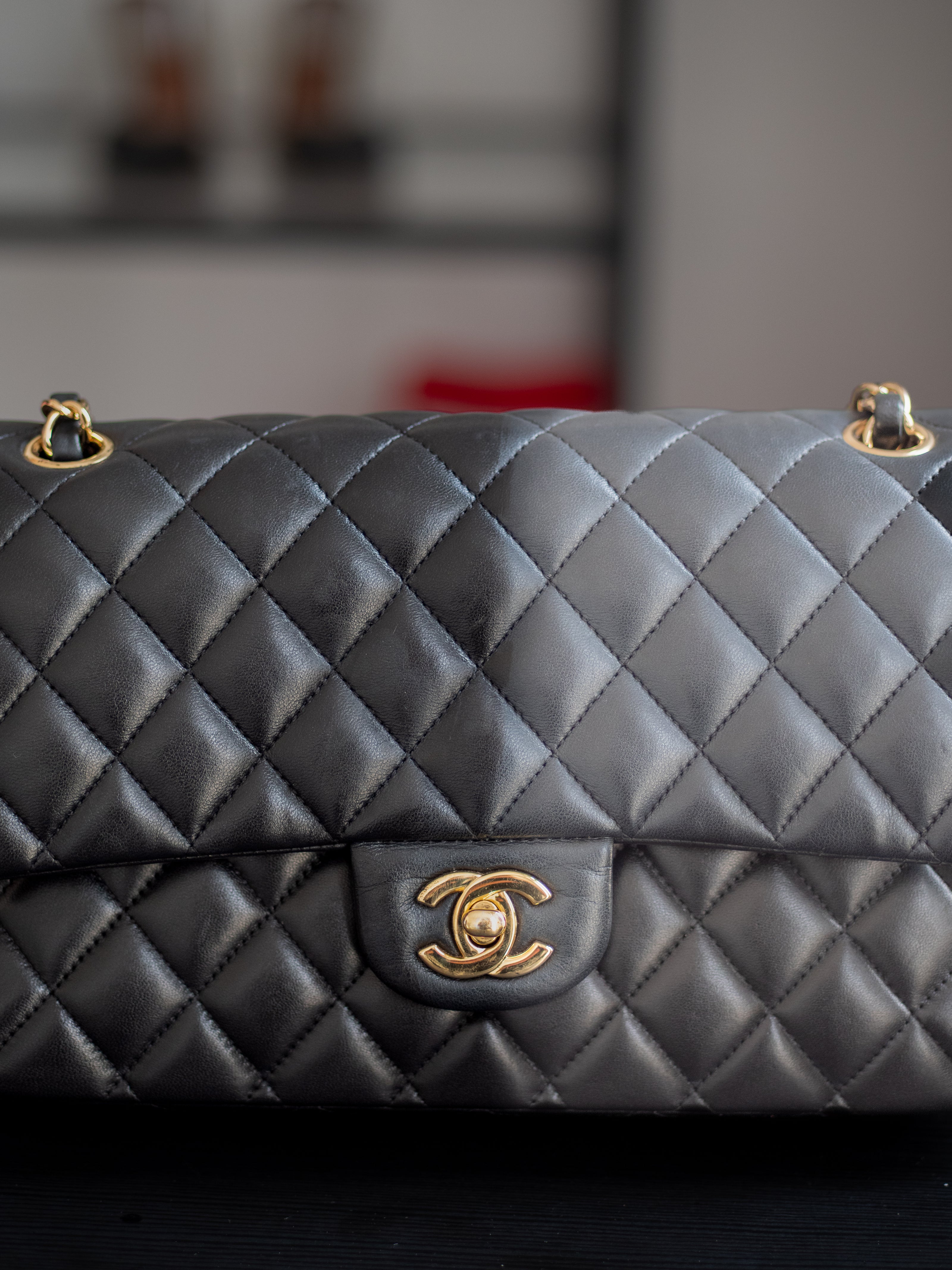 half restored black chanel quilted handbag with gold hardware